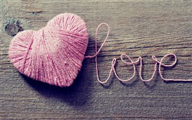 Amor e em forma de coração de lã cor de rosa