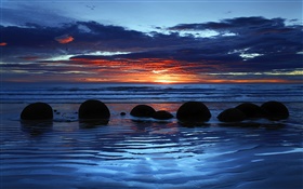 Moeraki Boulders, Koekohe Praia, mar, pôr do sol, South Island, Nova Zelândia
